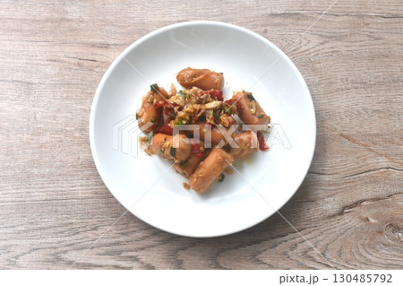 deep fried salty pork sausage with chop garlic and chili pepper arranging on plate  130485792