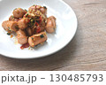 deep fried salty pork sausage with chop garlic and chili pepper arranging on plate  130485793