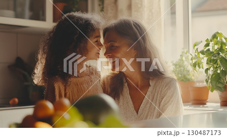 granddaughter and grandmother sharing a tender moment in the kit 130487173