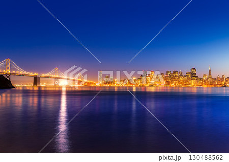 San Francisco sunset skyline California bay water reflection San Francisco sunset skyline California bay water reflection 130488562