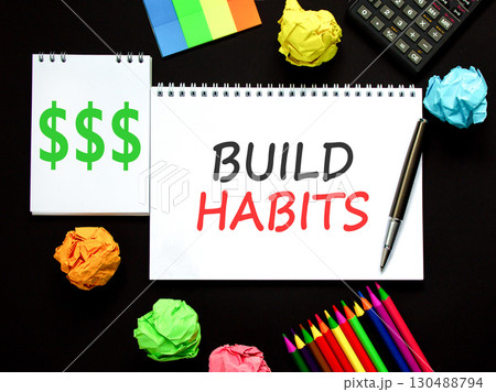 Build habits symbol. Concept word Build habits on beautiful white note. Black calculator. Black pen. Beautiful black paper background. Business build habits concept. Copy space. 130488794