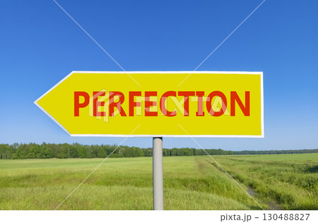 Perfection symbol. Concept word Perfection on beautiful yellow road sign. Beautiful blue sky green grass and forest peaceful nature background. Business perfection concept. Copy space. 130488827