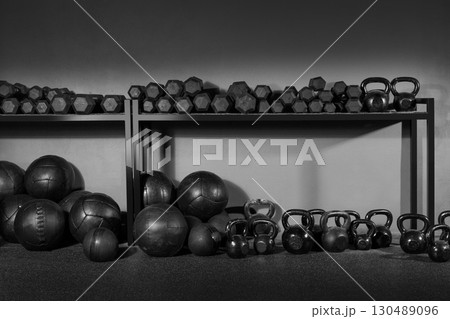 Kettlebell and dumbbell weight training gym Kettlebell and dumbbell weight training gym 130489096