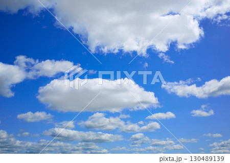 Blue sky with clouds in a summer day Blue sky with clouds in a summer day 130489139