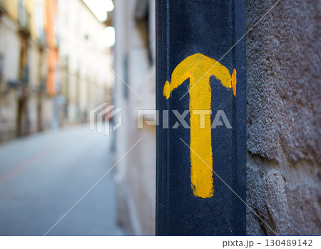 Burgos city Way of Saint James yellow arrow sign 130489142