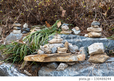 Stone pile in a temple. It is believed that stacking the stones will bring good fortune to the stacker and their family Stone pile in a temple. It is believed that stacking the stones will bring good fortune to the stacker and their family 130489244