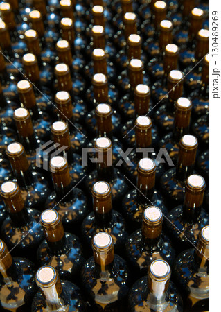 Wine bottles in a row as a pattern with cork Wine bottles in a row as a pattern with cork 130489269