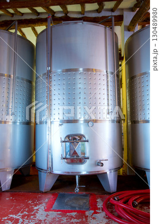 Stainless steel fermentation tanks vessels in winery 130489980