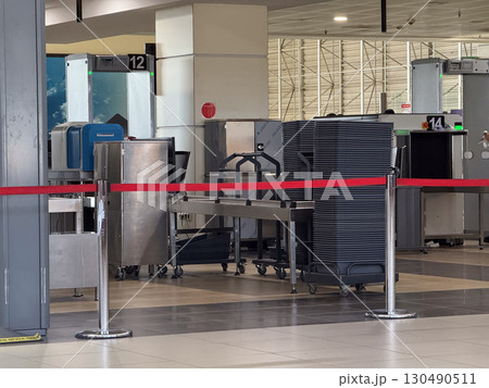 Airport security checkpoint with scanning machines and gates. Safety, regulation and travel control in modern transportation systems. 130490511