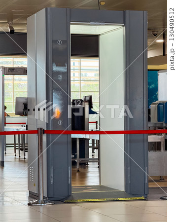 Close-up of airport security scanner with red barrier. Travel, safety, and regulation in controlled transportation environments. 130490512
