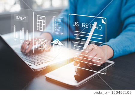 US IRS 1040 form or  US Individual income tax Concept,accountant holding pen working on calculator business with data accounting documents and a laptop, pay tax in 2024 years,new year 2024 tax concept 130492103