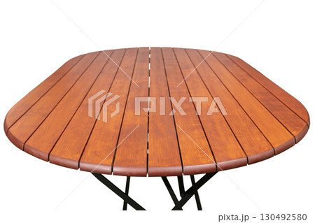 Round wooden table with metal legs on a white background. 130492580
