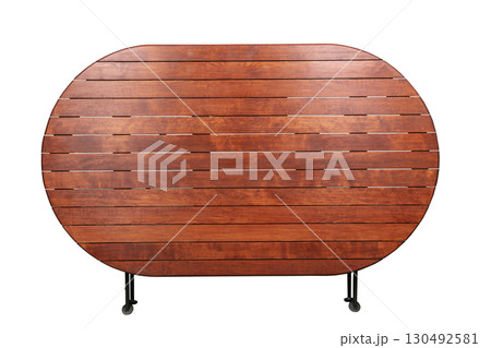 Round wooden table with folded metal legs on a white background. Round wooden table with folded metal legs on a white background. 130492581