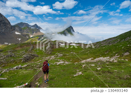 Sporty woman hiking in Switzerland alps. Heathy lifestyle, sport, beauty in nature. Grindelwald valley, Swizz 130493140