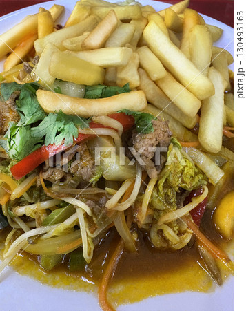 Vietnamese cuisine. French fries and meat with vegetables. Sprouts sprouted Close up Vietnamese cuisine. French fries and meat with vegetables. Sprouts sprouted Close up 130493163