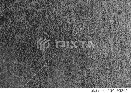 Close up, macro structure of gray suede fabric with abstract embossed shabby, messy texture. 130493242