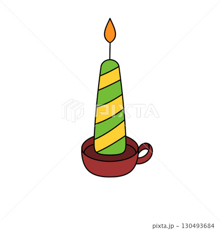A green and yellow candle with a yellow stripe on it is lit A green and yellow candle with a yellow stripe on it is lit 130493684