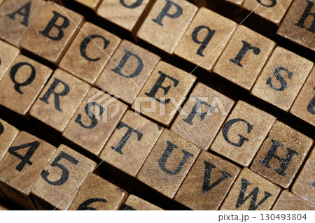 Jumbled up block wood print letters lined up 130493804