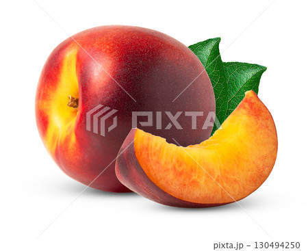Nectarine peach fruit and slice isolated with green leaves. 130494250