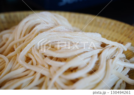 Freshly Made Kalguksu Noodles Close-Up.Flour-Dusted Handmade Pasta Freshly Made Kalguksu Noodles Close-Up.Flour-Dusted Handmade Pasta 130494261