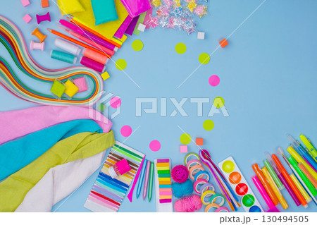 Arts and crafts supplies in the form of a round frame on blue trending background.Kids activities and childrens crafts. 130494505