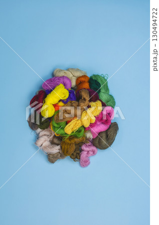 Mouline threads for embroidery displayed in a circle. Close up threads for sewing embroidery. Set of colored mouline. Mouline threads for embroidery displayed in a circle. Close up threads for sewing embroidery. Set of colored mouline. 130494722