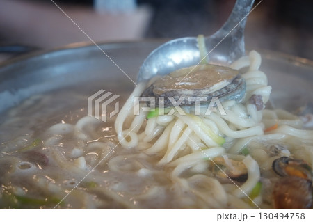 Seafood Kalguksu Noodles with Mixed Seafood, Korean Handmade Noodle Soup Seafood Kalguksu Noodles with Mixed Seafood, Korean Handmade Noodle Soup 130494758