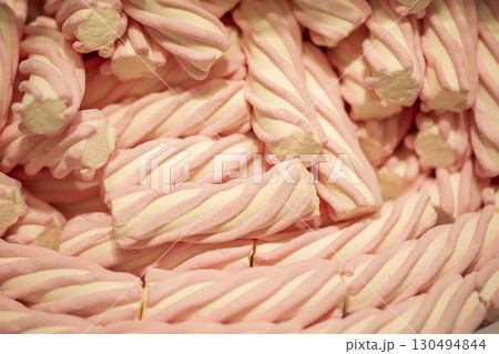 Pink candy marshmallows sticks.Background from jelly sweets. 130494844