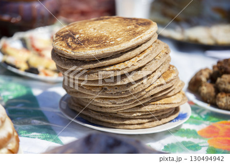 A stack of rye flour pancakes on the table. A stack of rye flour pancakes on the table. 130494942
