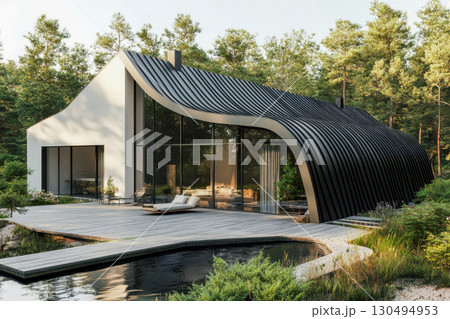 Modern house with a curved black roof and large glass walls. Set in a green pine forest, featuring an outdoor patio, serene pond, and walkway. 130494953