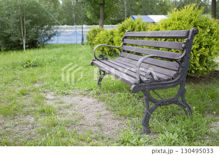 Wooden bench in a summer park. Wooden bench 130495033