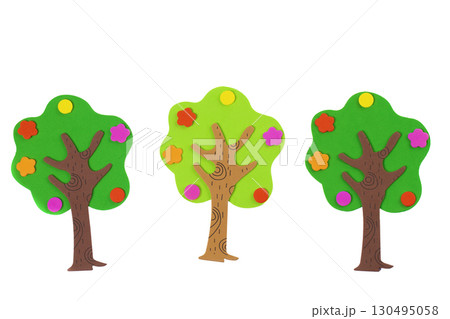 Handcrafted fabulous toy trees made from soft material. Tree on a white background. Garden and fertility concept. Handcrafted fabulous toy trees made from soft material. Tree on a white background. Garden and fertility concept. 130495058