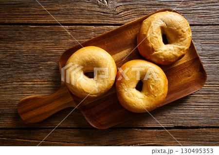 Bagels in a wooden board 130495353