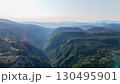 Majestic view of rolling hills and valleys at sunrise in a serene mountain landscape 130495901