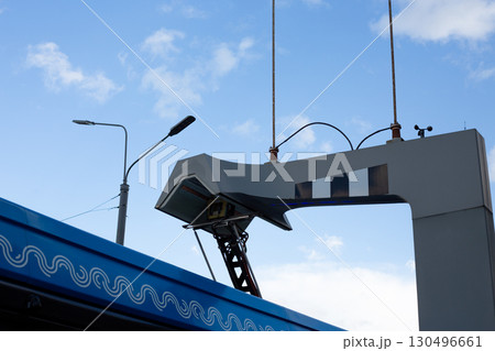 Electric bus charging station in city, highlighting modern technology and infrastructure integration with clean energy solutions. Futuristic touch to sustainable urban development 130496661