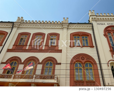Row of historic European buildings with large windows and detailed facades in Belgrade, Serbia. Urban heritage, architectural identity, and city tradition. Row of historic European buildings with large windows and detailed facades in Belgrade, Serbia. Urban heritage, architectural identity, and city tradition. 130497256