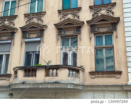 Row of historic European buildings with large windows and detailed facades in Belgrade, Serbia. Urban heritage, architectural identity, and city tradition. 130497269