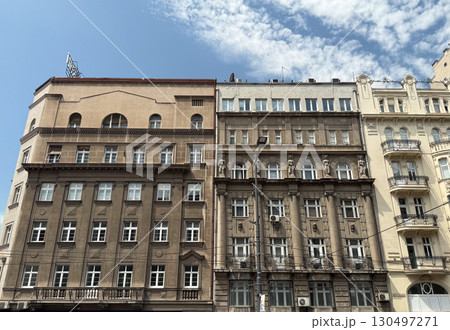 Row of historic European buildings with large windows and detailed facades in Belgrade, Serbia. Urban heritage, architectural identity, and city tradition. 130497271