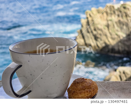 Morning cup of Italian coffee with a picturesque sea view Morning cup of Italian coffee with a picturesque sea view 130497481