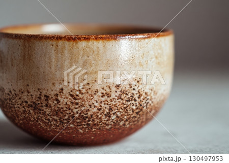 Rustic Ceramic Cup on Wooden Shelf 130497953