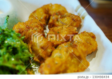 Golden Fried Chicken Karaage with Green Garnish Golden Fried Chicken Karaage with Green Garnish 130498434
