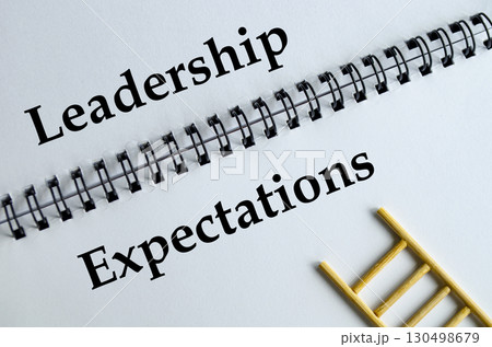 Leadership Expectations, Notebook with ladder illustration symbolizing guidance, responsibility, and influence. Leadership Expectations, Notebook with ladder illustration symbolizing guidance, responsibility, and influence. 130498679