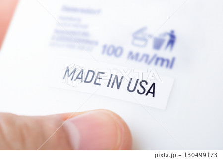 Close up of bottle with inscription Made in USA. Production of goods in USA concept 130499173