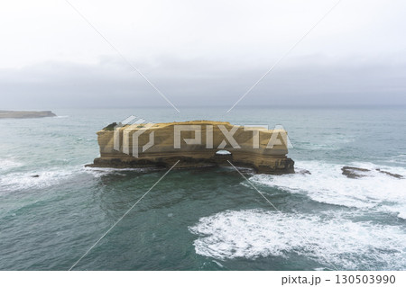 The Bakers Oven so called for the shape of the natural arch in the cliff face. A sea stack on the coast of the Great ocean Road, Australia. 130503990