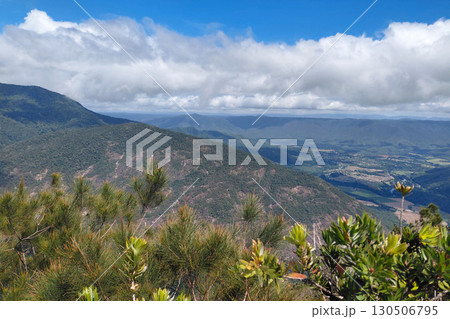 Breathtaking mountain landscape under cloudy blue sky from summit viewpoint 130506795