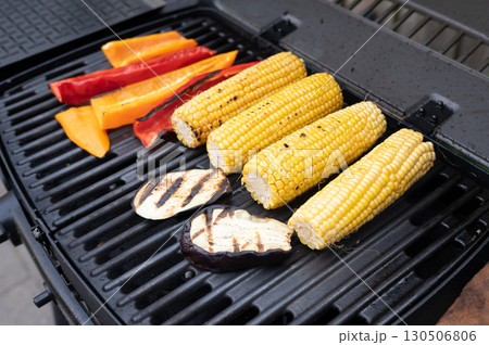 Grilled corn and vegetables on barbecue grill summer cooking 130506806