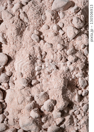 Close up view of edible indian black salt. Kala namak powder and chunks for cooking and seasoning. 130506913