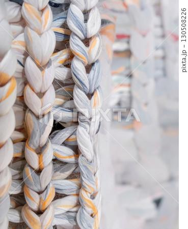 Abstract Macro View of Knitted Braids with Blue and Yellow Hues Abstract Macro View of Knitted Braids with Blue and Yellow Hues 130508226