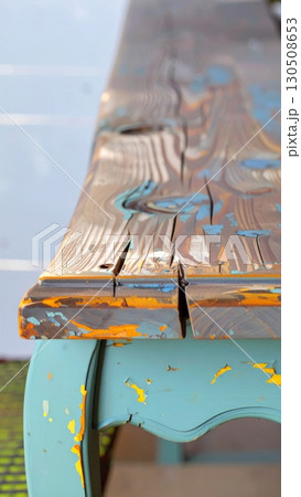 Close Up of Weathered Wooden Table with Blue and Orange Paint Detail Texture 130508653