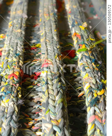 Braided Gray Blue Rug with Flecks of Color in Vertical Lines Close Up 130509572